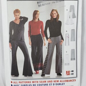 May include: A Burda 8410 sewing pattern envelope for pants in European sizes 36-48 and US sizes 10-22. The front displays three illustrations of pants styles labeled A, B, and C, with corresponding line drawings showing flared and straight-leg designs.