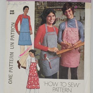 May include: Vintage Simplicity sewing pattern number 7254 for 'How to Sew' aprons. The pattern includes three different apron styles, one with a blue denim fabric, one with a pink fabric, and one with a red floral fabric. The pattern is for one size.