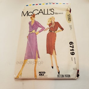 May include: A sewing pattern for a dress with a button-up front and a side slit. The pattern is for sizes 12-34 and is called McCall's 6719. The pattern is designed by Evelyn de Jonge.