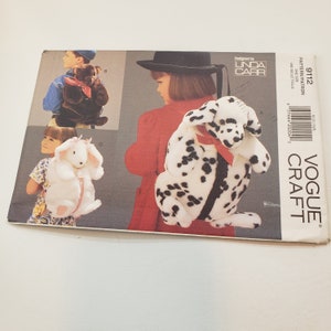 May include: A sewing pattern for making plush animal backpacks. The pattern includes instructions for making a dalmatian, a bear, and a bunny backpack. The pattern is from Vogue Crafts and is designed by Linda Carr.