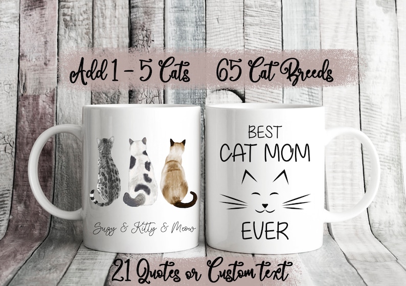 May include: Two white ceramic mugs with black text and illustrations. The mug on the left has three cats in a row, with the text "Suzy & Kitty & Meow". The mug on the right has the text "BEST CAT MOM EVER" with a cat face illustration. The text "Add 1-5 Cats 65 Cat Breeds" is at the top of the image, and the text "21 Quotes or Custom text" is at the bottom.