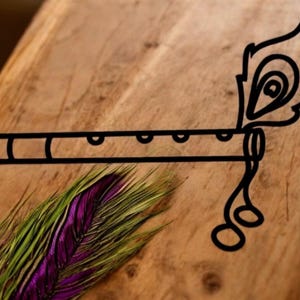 May include: Black outline of a flute with a peacock feather design. The flute has several holes and a decorative feather element. A vibrant purple and green peacock feather lies below the flute on a wooden surface.