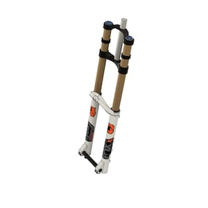 May include: White mountain bike suspension fork with black and orange accents. The fork is made by Fox and has a 36 written on the side.