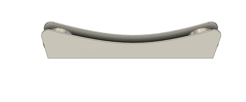 May include: A silver metal roller with a curved design. The roller is designed to hold a piece of paper or fabric in place.