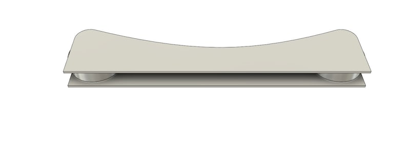 May include: A white ceramic toilet seat riser with two round, white plastic supports. The riser is designed to elevate the toilet seat.