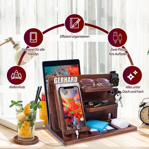 May include: A wooden desktop organizer with multiple compartments for storing items like phones, tablets, keys, and glasses. It features a charging station with two slots for charging devices. The organizer is made of pine wood and has a natural wood finish.