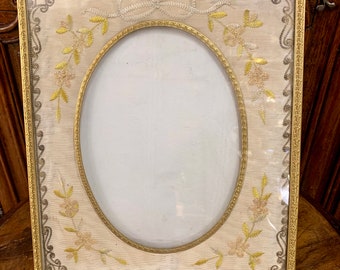 An antique French ormolu embroidered Napoleon III photo frame circa 1870