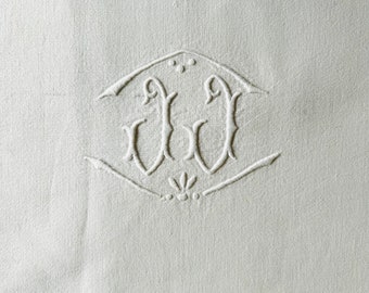 An antique French white fine métis linen extra large sheet with a white ladder work border and an embroidered monogram J J circa 1930