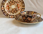 A Royal Crown Derby porcelain Imari pattern 2451 trio ( cup, saucer and tea plate) circa 1928