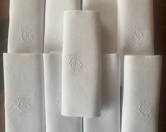 An antique set of 9 French white linen monogrammed napkins circa 1900