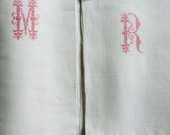 An antique French métis linen farmhouse sheet with a red embroidered monogram MR