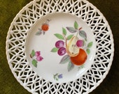 An antique eighteenth century Marcolini Meissen hand-decorated plate with basket weave border circa 1780