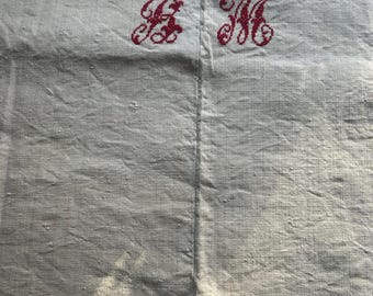 a nineteenth century French heavy metis linen or hemp red stitch monogrammed BM farmhouse sheet with a central seam