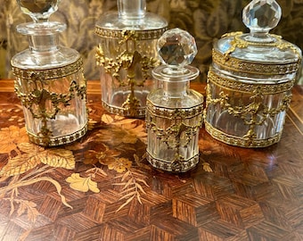 a French antique set of 4 Baccarat style dressing table bottles in glass and ormolu circa 1890