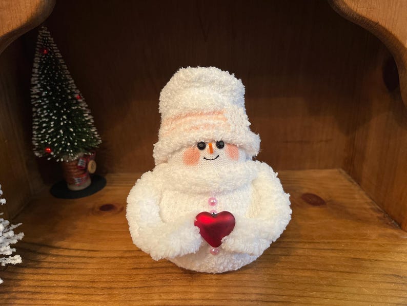 Snowmen,sock penguins and sock bunnies. white/pink buttons