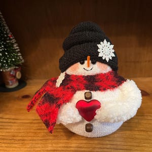 Snowmen,sock penguins and sock bunnies. Black hat/heart