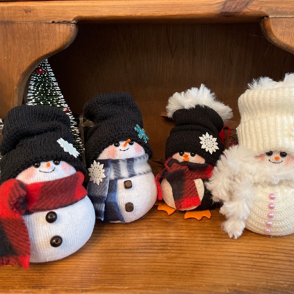Mini snowman, mini snow girl, and mini penguins.