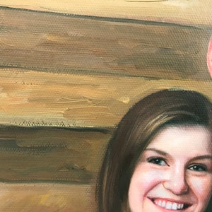 May include: A close-up portrait painting of a couple. The woman has long brown hair and is smiling. The man is wearing a dark shirt and is looking off to the side. The background is a wooden wall.
