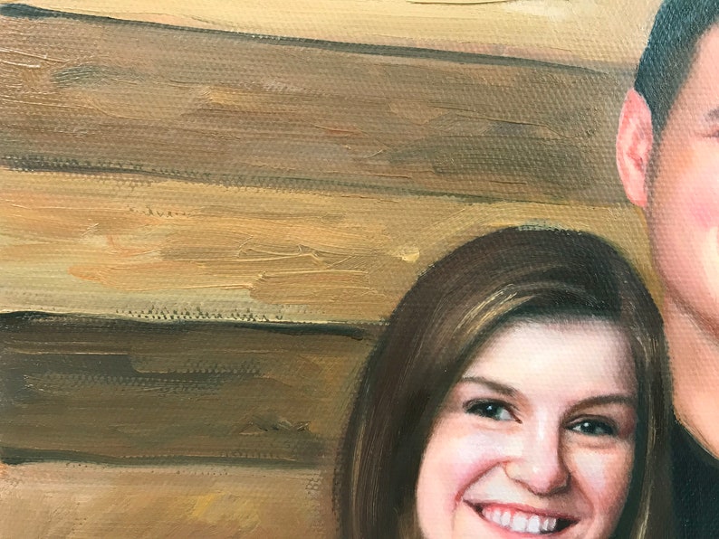 May include: A close-up portrait painting of a couple. The woman has long brown hair and is smiling. The man is wearing a dark shirt and is looking off to the side. The background is a wooden wall.