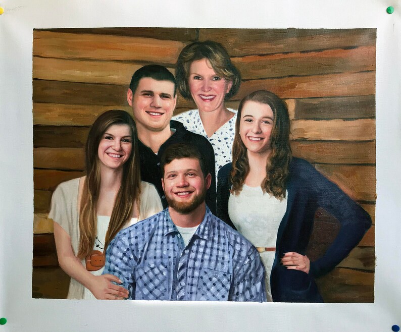 May include: A painting of a family of five, including two women, two men, and one young woman. The family is posed in front of a wooden wall. The women are wearing white shirts, and the men are wearing blue shirts. The young woman is wearing a blue sweater.