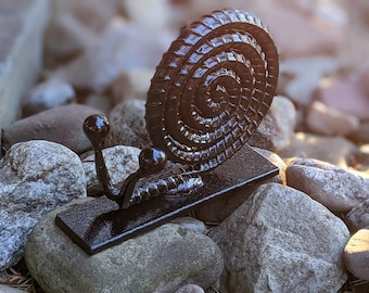 Hand-forged and upcycled rebar snail