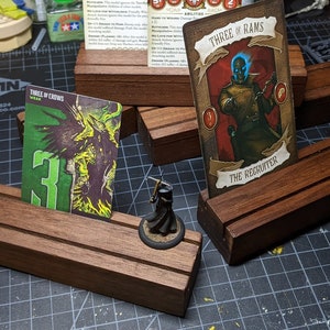 Handmade wooden playing card holders great for display or tabletop miniature games and card games like Malifaux