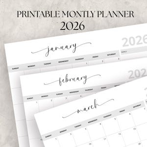 May include: A stack of white printable monthly planners for the year 2026. The top planner shows the month of January, with the word in elegant script. The other planners show February and March. The text "PRINTABLE MONTLY PLANNER 2026" is at the top.
