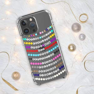 May include: A clear phone case with a design of colorful beads spelling out the names of Taylor Swift's albums: Taylor Swift, Fearless, Speak Now, Red, 1989, Reputation, Lover, Folklore, Evermore, Midnights, and 1989.
