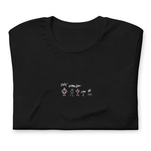 May include: Black t-shirt with a white drawing of stick figures and the text "DRX GAMER GIRL" and "GHOST HA! ???".