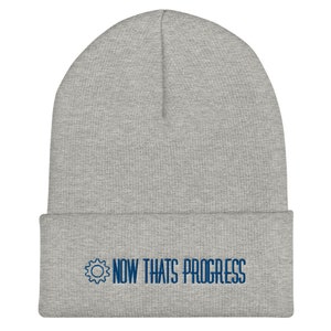 May include: Grey beanie with a blue embroidered gear and the text "NOW THATS PROGRESS".