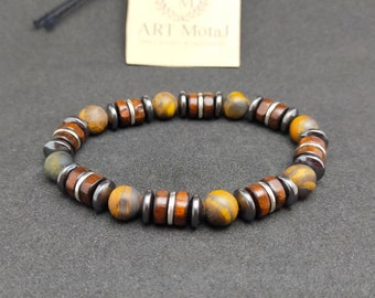 May include: A brown, black, and silver beaded bracelet with tiger's eye stones.