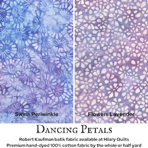 May include: Two fabric swatches with floral and swirl patterns. The left swatch is periwinkle with white swirls, and the right is lavender with white flower shapes. The text "Swirls Periwinkle" and "Flowers Lavender" are visible.
