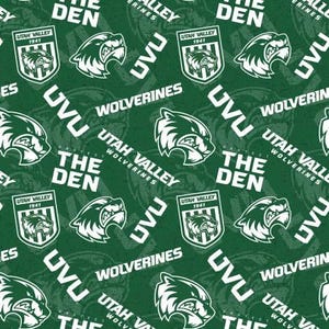 May include: Green and white fabric with a repeating pattern of a wolverine mascot, the words "Utah Valley Wolverines", and "The Den".