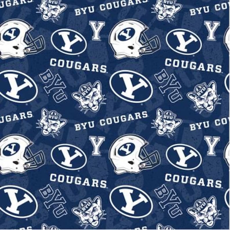 May include: A blue and white fabric with a repeating pattern of the BYU Cougars logo, the letters BYU, and the words "BYU Cougars".