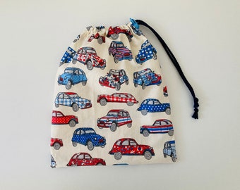 Waterproof bag for wet swimsuit in beige coated cotton fabric with 2CV car motifs