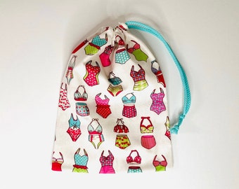 Waterproof bag for wet swimsuit in coated cotton fabric with 50s swimsuit patterns Pink/turquoise