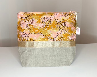 Tall toiletry bag in natural linen and pink and gold Japanese fabric.