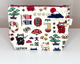 Toiletry bag in off-white fabric with multi-colored Japanese patterns