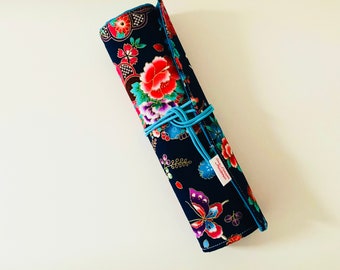 Makeup or paint brush kit in navy blue Japanese fabrics with flowers and butterflies and matching turquoise blue cotton fabrics.