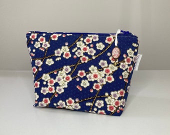 Makeup bag in blue Japanese fabric with pink and white flowers