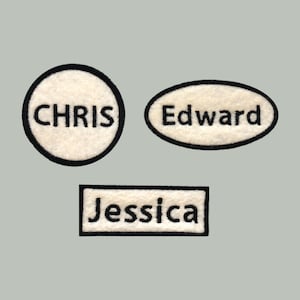 May include: Three white felt name tags with black outlines and black text. The name tags read "Chris", "Edward", and "Jessica".
