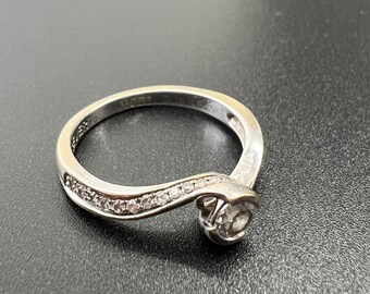 Solitaire Diamond ring .20ct Set in a White 18ct Gold Crossover Setting with Diamond Shoulders Size J1/5