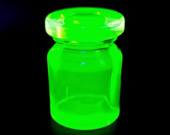 Frasco de vidrio de uranio con tapa, vidrio amarillo vaselina, pequeña figura Art Déco