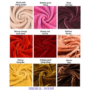 May include: Nine fabric swatches in different colors, including blush pink, bubble gum pink, plum, strong orange, deep red, salmon, yellow, antique gold, and brown. The fabric is velvet and has a swirl pattern. The text "Xưởng kh&acirc;u tay - sew by hand" is at the bottom of the image.