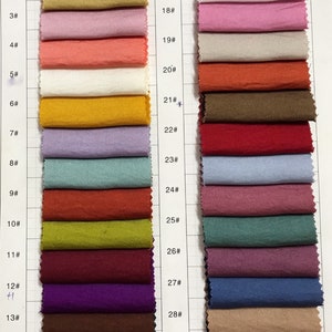 May include: A color chart of 30 fabric swatches, numbered 1 through 30. The swatches are arranged in two columns, with the numbers 1-15 on the left and 16-30 on the right. The swatches are a variety of colors, including red, orange, yellow, green, blue, purple, brown, and black.