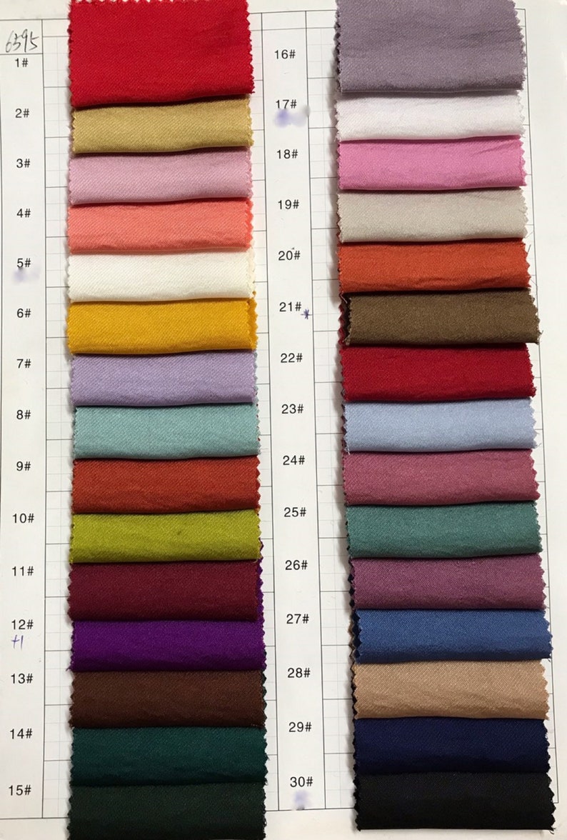 May include: A color chart of 30 fabric swatches, numbered 1 through 30. The swatches are arranged in two columns, with the numbers 1-15 on the left and 16-30 on the right. The swatches are a variety of colors, including red, orange, yellow, green, blue, purple, brown, and black.