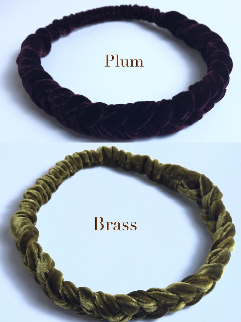 May include: Two velvet headbands, one in a dark plum color and the other in a dark olive green color. The headbands are braided and have a stretchy fit.