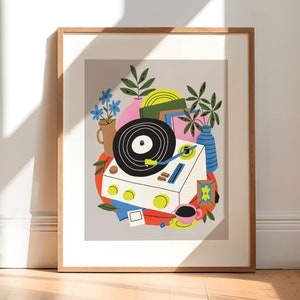 May include: A framed illustration of a vintage record player with a record on the turntable, surrounded by colorful abstract shapes and plants. The illustration is in a modern style with bold colors and simple lines.