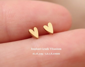 May include: A pair of small gold heart-shaped earrings made of implant grade titanium. The earrings are 5.6 to 7.8 millimeters in size and weigh 1.6 to 1.8 grams.