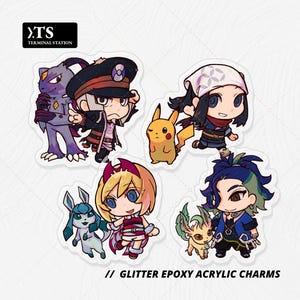 May include: Four glitter epoxy acrylic charms featuring chibi-style anime characters and creatures. The designs include a purple creature with a dark-hatted figure, a yellow electric mouse with a person, a blue creature with a blonde character, and a green creature with a dark-haired character. Text reads TS TERMINAL STATION and GLITTER EPOXY ACRYLIC CHARMS.